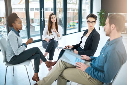 Business people, documents and meeting in office for brainstorming, collaboration and conversation. Coworkers talking or communication in workplace for teamwork, report and reading proposal together.