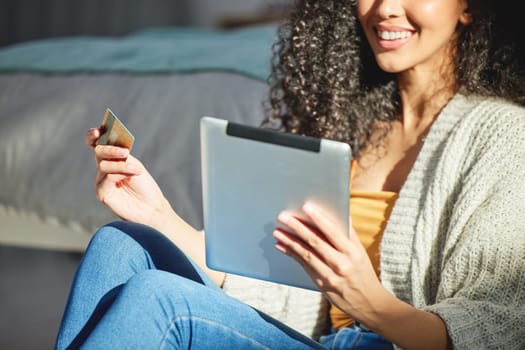 Woman, tablet and hands with credit card and online shopping payment for digital tech on store app. Ecommerce, technology and happy from purchase and buying on internet website with smile at home.