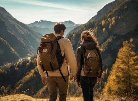 A couple hiking in the mountains, pausing to take in the breathtaking view
