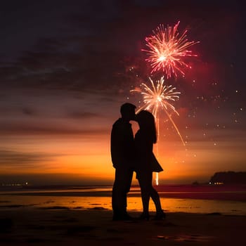 Silhouette of a couple kissing on the beach at sunset with fireworks shooting in the sky. New Year's fun and festivities. A time of celebration and resolutions.