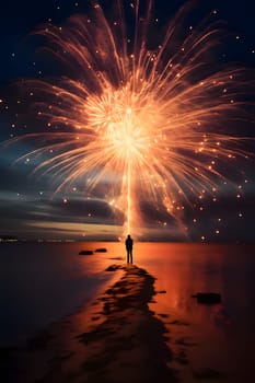 Silhouette of a man on the beach in the sky firing fireworks. New Year's party and celebrations. A time of celebration and resolutions.