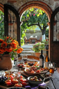 Mexican food, glasses, and wine on table.