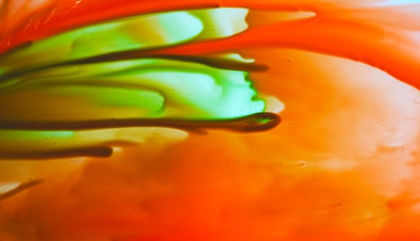 liquid paints in slow blending flow. Beautiful abstraction of liquid paints.