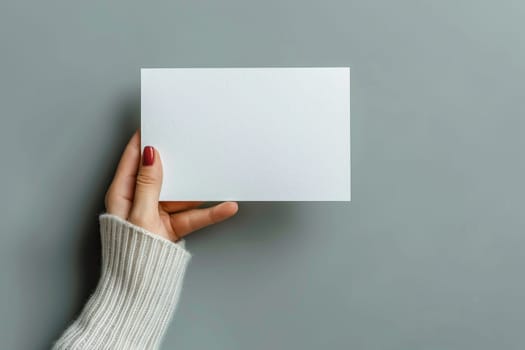 Hand holding white blank book mockup, isolated