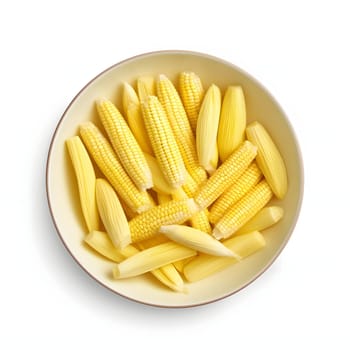 Yellow corn cobs and those still unripe in a bowl, top view. Corn as a dish of thanksgiving for the harvest, picture on a white isolated background. An atmosphere of joy and celebration.