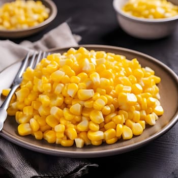 Yellow corn kernels on a plate. Corn as a dish of thanksgiving for the harvest. An atmosphere of joy and celebration.