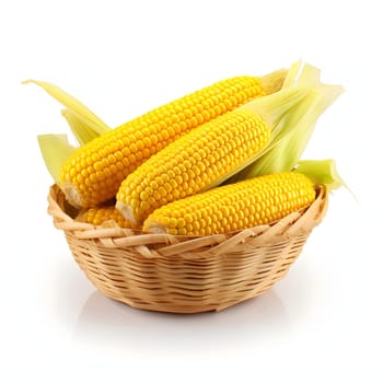 Yellow corn cobs with leaves in a wicker basket. Corn as a dish of thanksgiving for the harvest, a picture on a white isolated background. An atmosphere of joy and celebration.