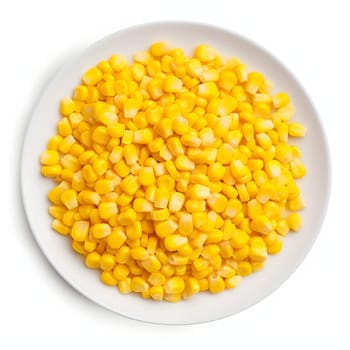Top view over a white plate full of yellow corn kernels. Corn as a dish of thanksgiving for the harvest, a picture on a white isolated background. An atmosphere of joy and celebration.
