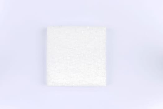 A square piece of white styrofoam