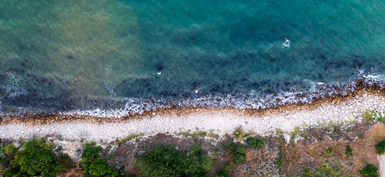Top view aerial photo from a flying drone of the beautiful transparent sea and coastline