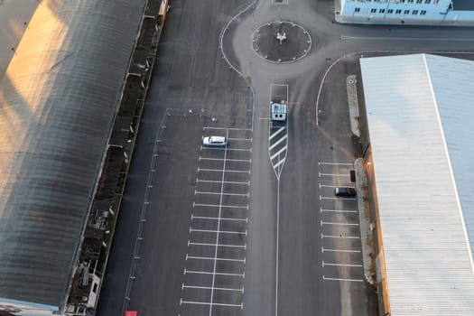 Abstract aerial view from a drone of circle junction road and car parking
