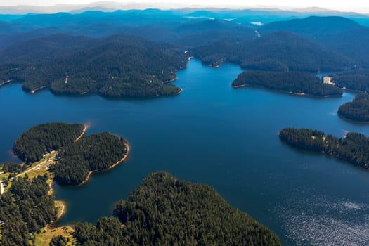 Stunning aerial view at Dam Shiroka Poliana, Bulgaria,  Beautiful blue water and green forest.