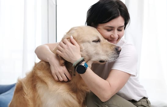 Owner Woman Petting Adorable Golden Retriever Dog, Family Dog At Home