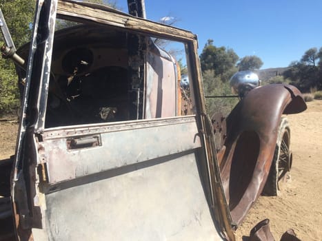 Rusty Old Car Abandoned in Near Wall Street Mill in Joshua Tree National Park . High quality photo