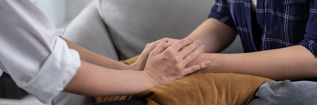 Close up shot of supportive and comforting hands for cheering up depressed person or stressed mind with utmost empathy