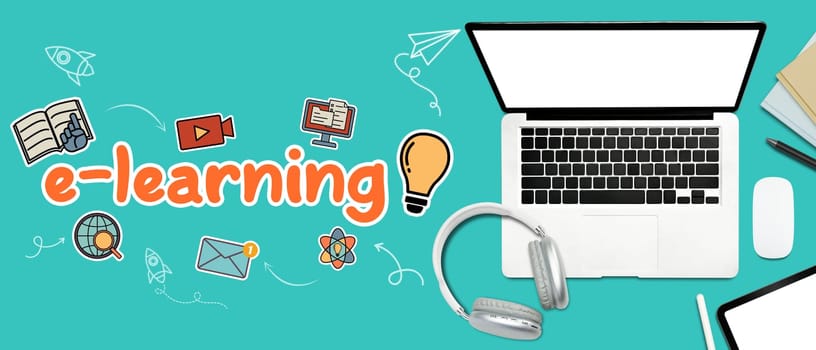 Laptop, headphone and stationery on blue background with the word e-learning.