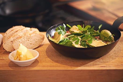 Cooking, restaurant and food in pan on table for dine dining supper, dinner and lunch in kitchen. Recipe, diet and utensils on counter with ingredients for wellness, nutrition and healthy eating.