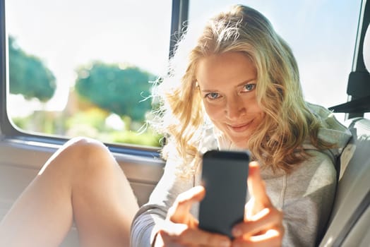 Woman, portrait and smartphone in car for photo, memory and road trip while on vacation or travel. Female person, smile and phone in vehicle for picture, fun and adventure while on holiday in Arizona.