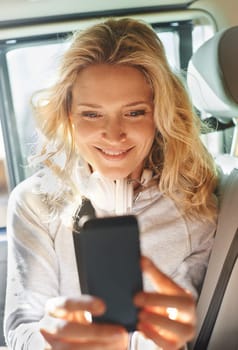 Woman, selfie and phone in car, smile and road trip for memories, social media and post. Excited, technology and travel or internet, picture and livestream for communication, happy and mobile app.