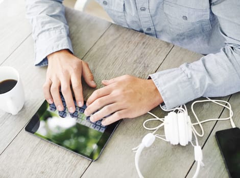 Table, sun and hand with typing on tablet for communication, networking and online search. High angle, morning and man with digital technology on desk for social media, website and text message.