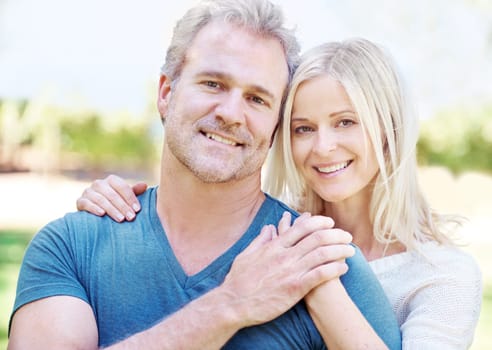 Mature, couple and portrait embrace in garden with relationship smile for vacation, anniversary or connection. Man, woman and face or countryside forest for New Zealand holiday, together or travel.