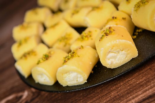 LEBANESE PASTRY RECIPE, ORIENTAL FOOD, HALAWET AL JEBEN, MOZARELLA, ASHTA AND FINE SEMOLINA. High quality photo