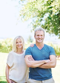 Mature, couple and portrait smile in park for travel vacation or summer holiday, backyard or anniversary. Man, woman and face in forest for exploring Australia with happiness, bonding or outdoor.