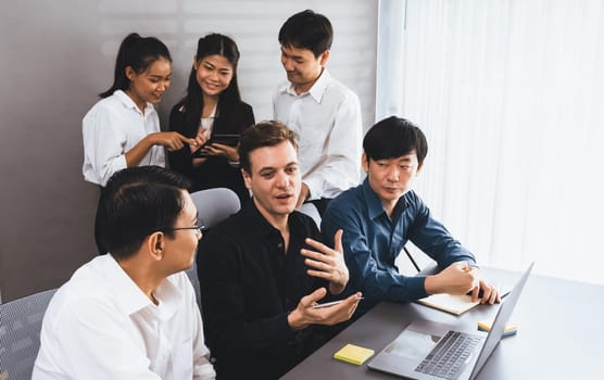 Group of diverse office worker employee working together on strategic business marketing planning in corporate office room. Positive teamwork in business workplace concept. Prudent