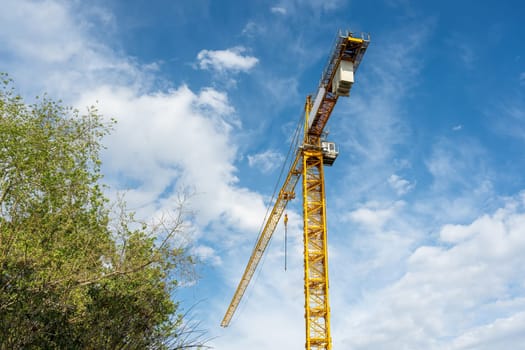 Construction crane working on large construction site