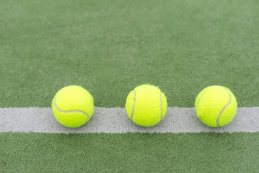 close up of a padel and tennis court with artificial grass and balls. High quality photo