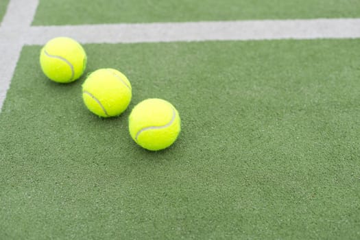 Tennis ball on green grass. High quality photo