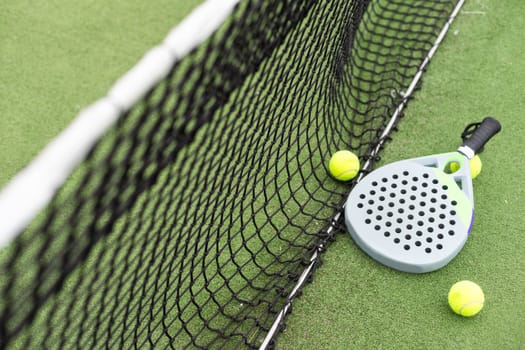 Paddle tennis racket and ball. High quality photo