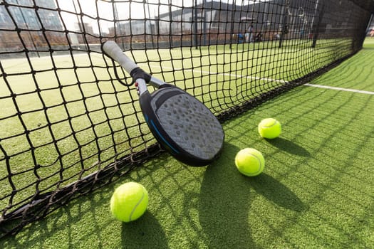 Paddle tennis racket and ball. High quality photo