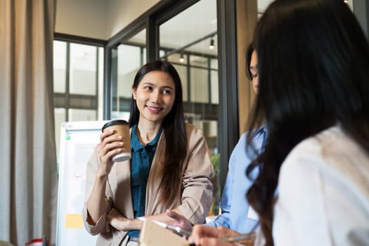 Business woman talking and brainstorming, discussion with colleague about strategy.