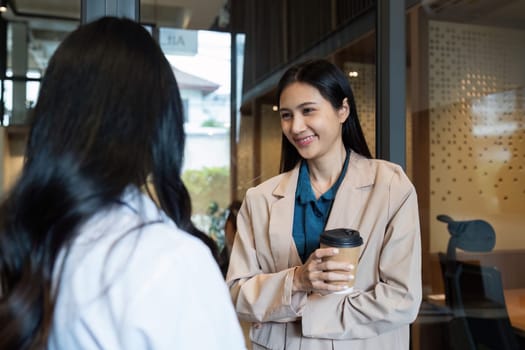 Business woman talking and brainstorming, discussion with colleague about strategy.