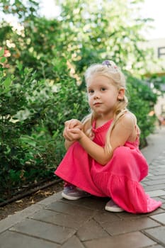 Child with hearing problem and cochlear implant dance in street, deaf kid began to hear. Hearing loss in childhood and treatment concept. Copy space and empty place for text.