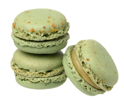 Stack of pistachio macarons on isolated background, close up