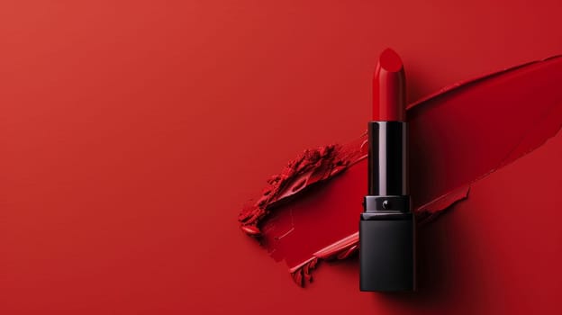 Close up of red lipstick on red background.