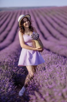 A woman is standing in a field of purple flowers, wearing a white hat and a purple dress. She is holding a bouquet of flowers in her hand. Concept of serenity and beauty