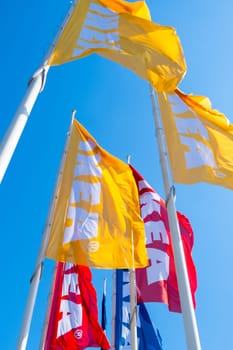PRAGUE, CZECHIA -APRIL, 2024: IKEA flags yellow, red and blue with sky on the background.