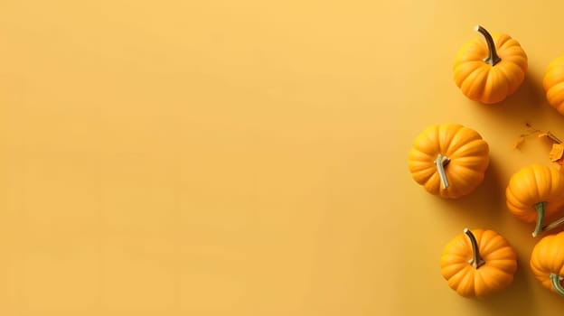 Top view of the stacked orange pumpkins on the right side, banner with space for your own content. Bright yellow background colors. Blank space for caption.