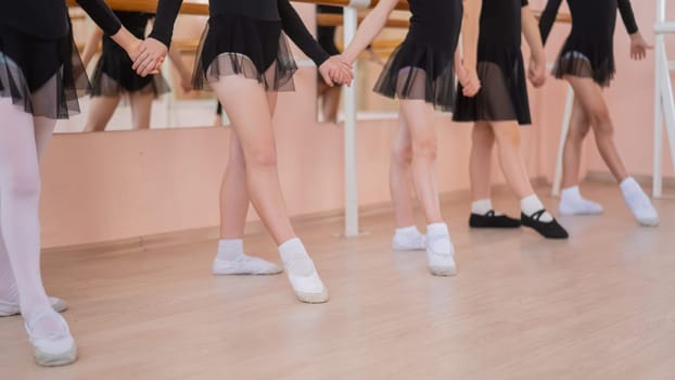 Close-up of five little girls' feet and ballet class