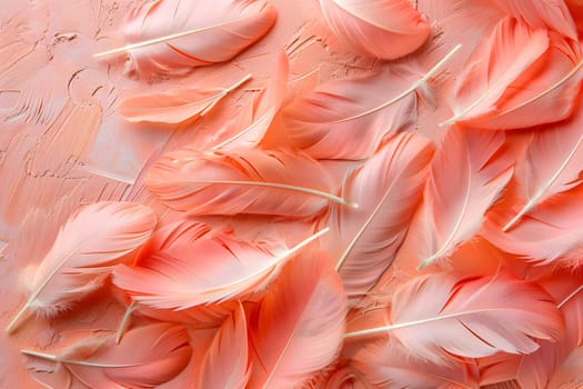 A collection of peach and magenta feathers rests on a pink surface, resembling petals of a flowering plant. The closeup view showcases the delicate details of each feather