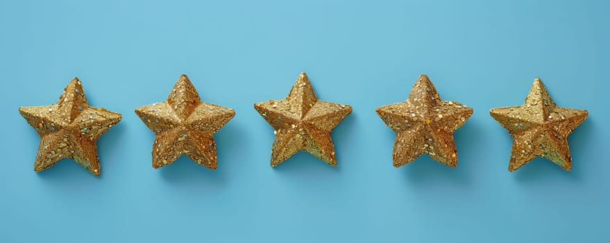 Five golden glitter stars on blue background.