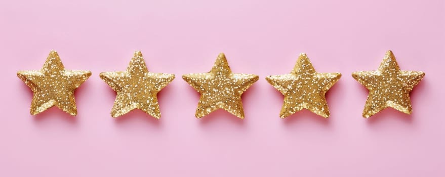 Five gold glitter stars on a pink background.