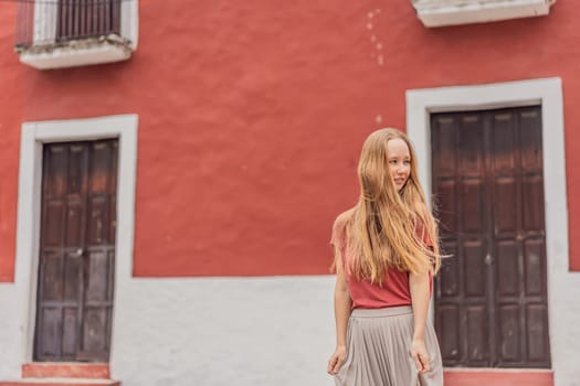 Woman tourist explores the vibrant streets of Valladolid, Mexico, immersing herself in the rich culture and colorful architecture of this charming colonial town.