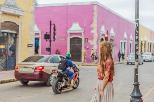 Woman tourist explores the vibrant streets of Valladolid, Mexico, immersing herself in the rich culture and colorful architecture of this charming colonial town.