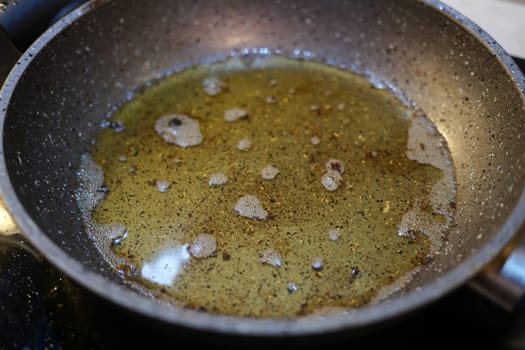 used cooking oil in frying pan