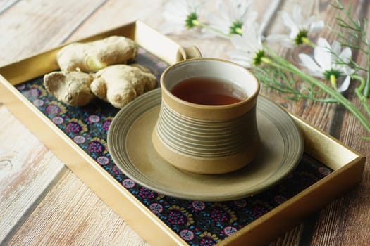 Ginger tea on wooden background