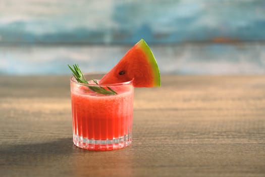 Summer drink, Glass of fresh watermelon juice on wooden table with copy space.